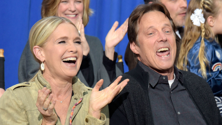 Matthew Ashford and Melissa Reeves laugh at an event. 