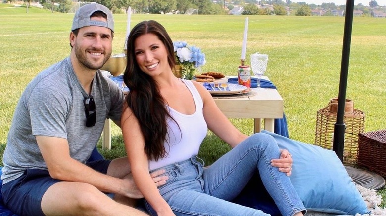 JJ Lane posing with his wife Kayla Hughes