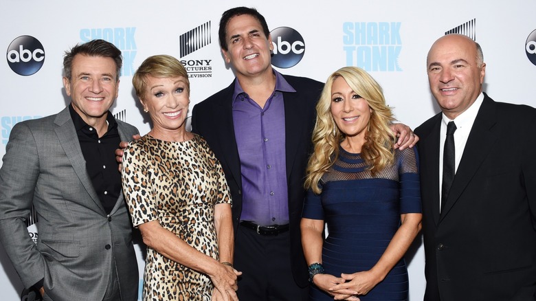 Robert Herjavec, Barbara Corcoran, Mark Cuban, Lori Greiner, and Kevin O'Leary smiling