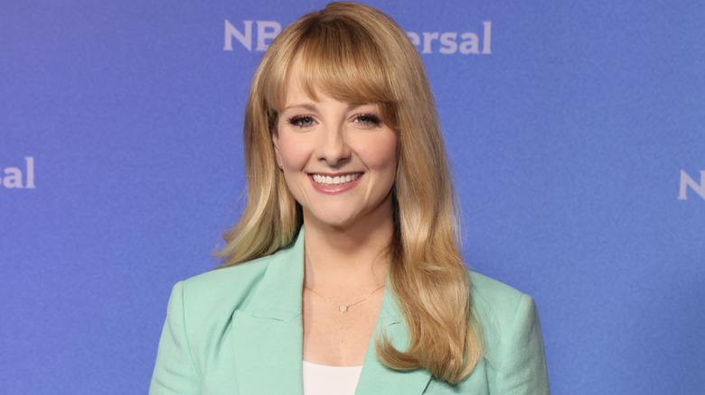 Melissa Rauch smiling in teal blazer