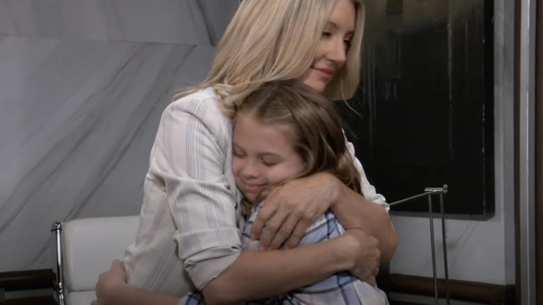 Cynthia Watros embracing Scarlett Fernandez