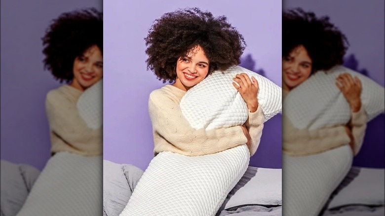 Woman holding a PUFF pillow