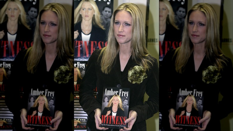 Amber Frey poses with her 2005 book