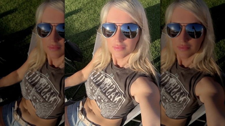 Amber Frey takes a selfie wearing sunglasses in 2024