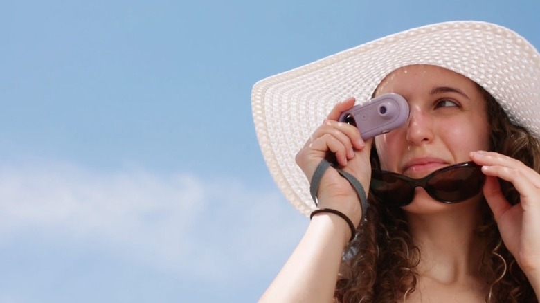 Woman looking through sunscreenr