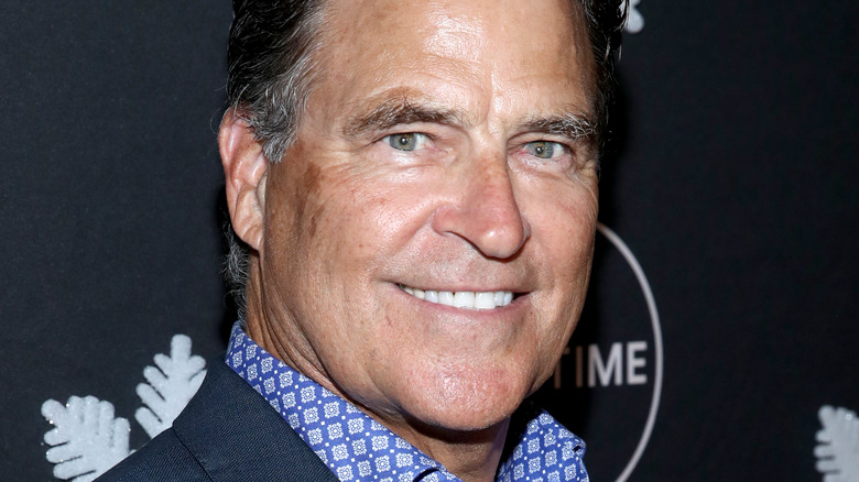 Ted McGinley smiling on the red carpet