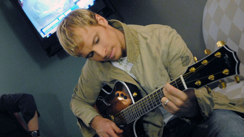 Brian Littrell playing guitar