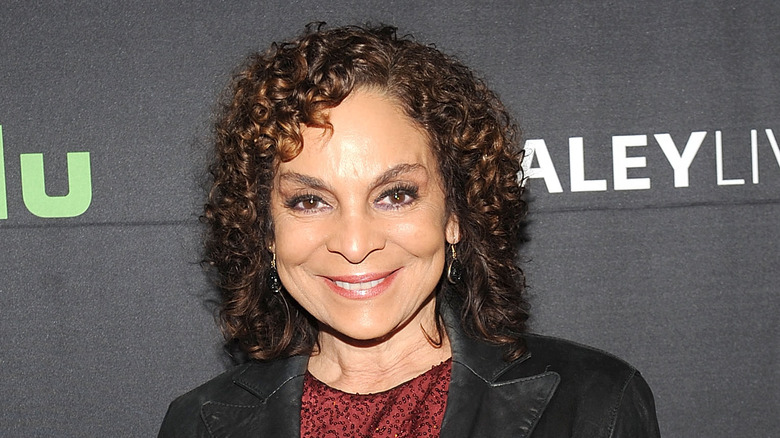 Jasmine Guy wearing a leather jacket