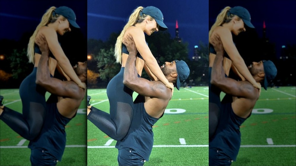 Karl Collins and Nicole Tutewohl at a football field