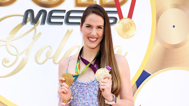 Missy Franklin posing with her Olympic medals 