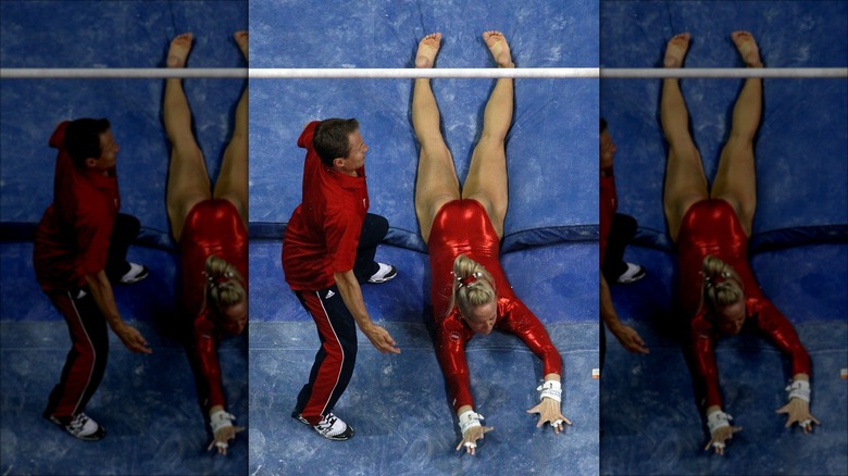 Nastia Liukin falls from the uneven bars