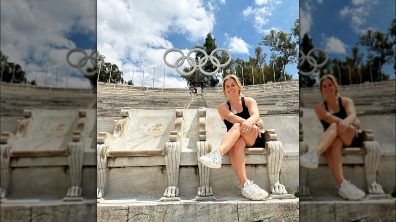 Shawn Johnson in front of Olympic rings