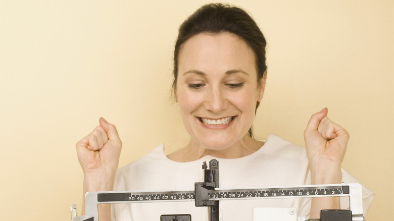 woman weighing herself