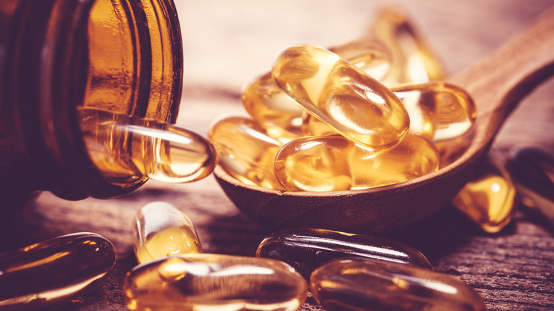 A close-up of vitamin D/omega capsules 