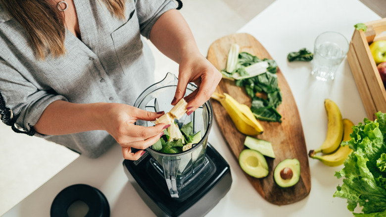 Woman making a healthy smoothie