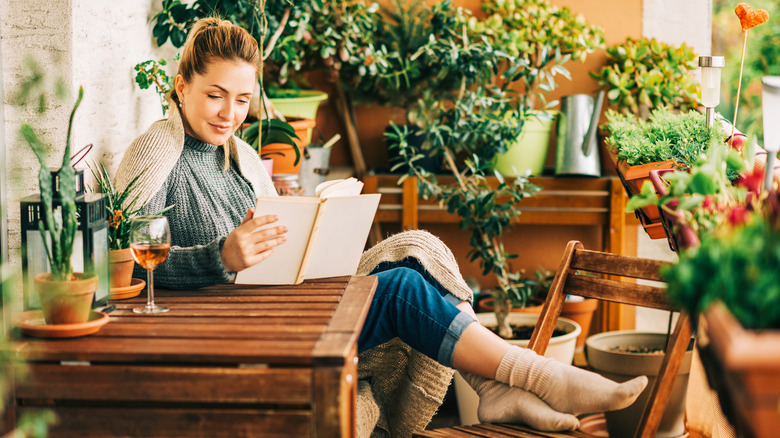 Woman reading on balcony