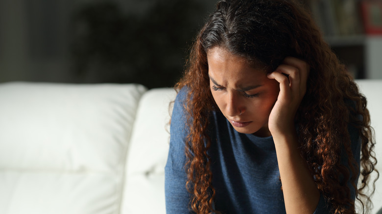 A woman feeling depressed because of daylight savings time