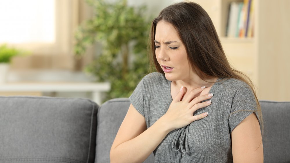 woman having chest pain