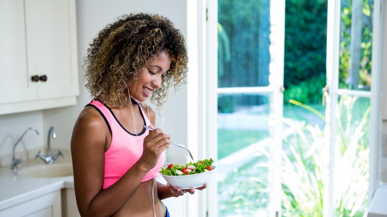 healthy woman eating salad