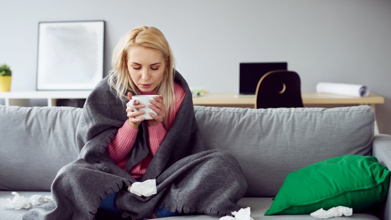 woman with cold drinking tea