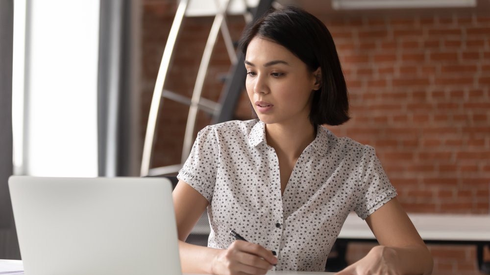 A woman working on a laptop