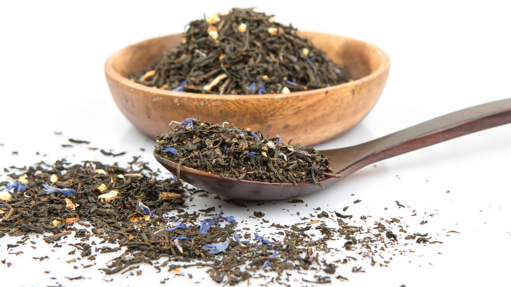 Loose tea in a bowl and spoon