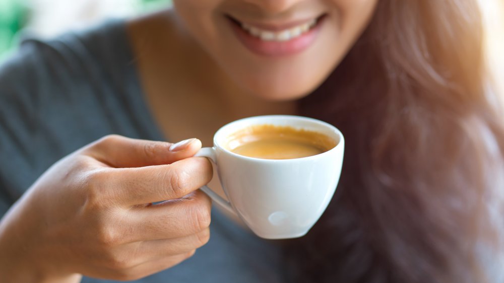 woman drinking espresso