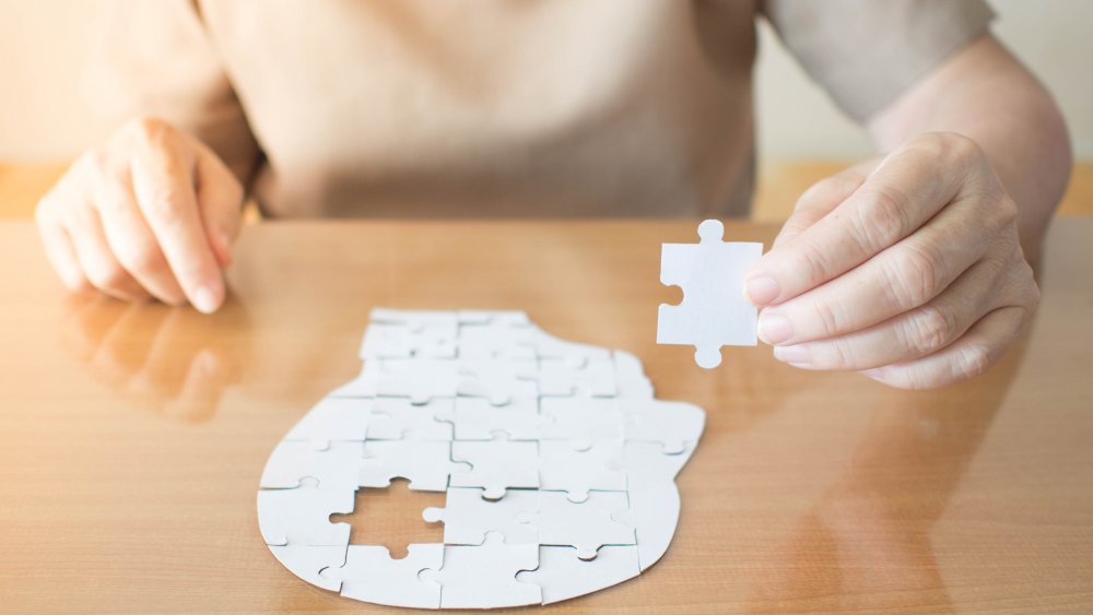 woman doing brain puzzle