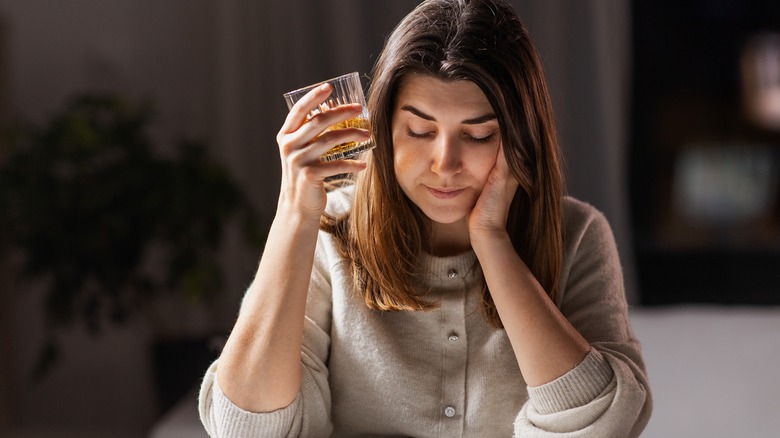 a whiskey drinker looking nonplussed