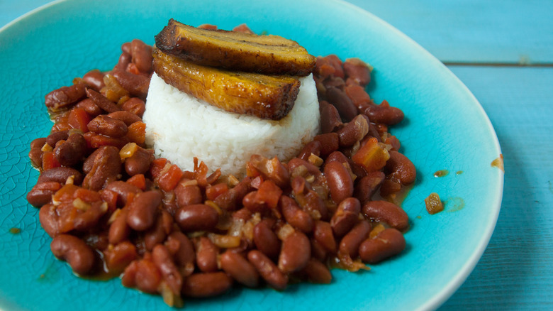 A plate of red beans and rice with plantains