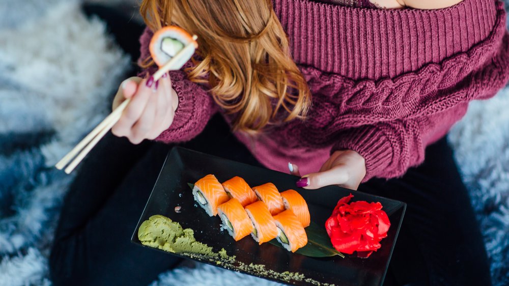 woman eating fish