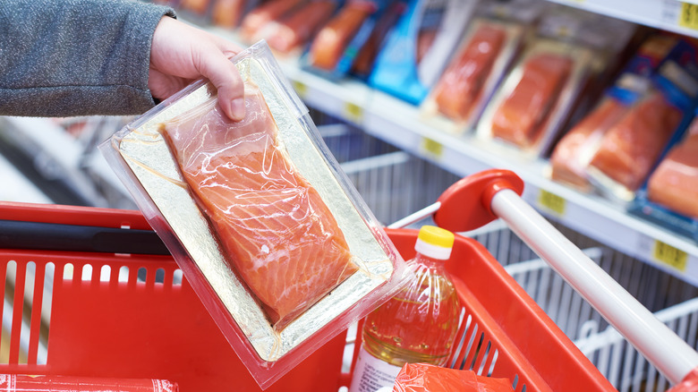 woman shopping for salmon