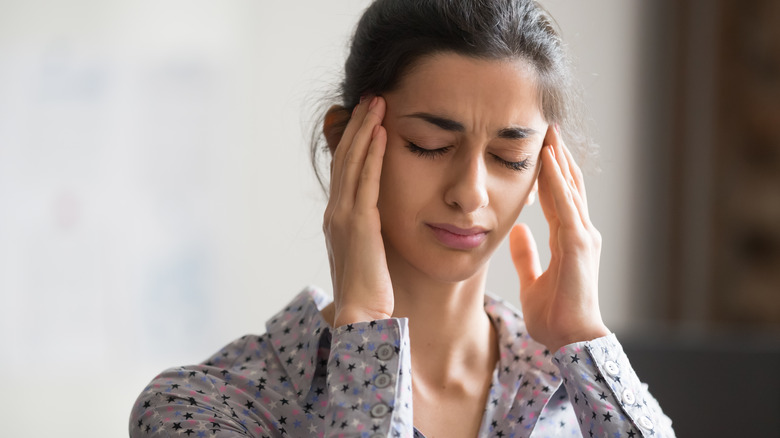 woman experiencing headache