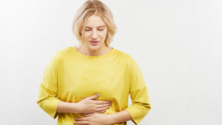 Woman with stomach pains