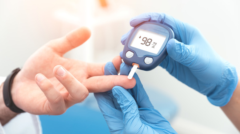 A person having their blood sugar checked