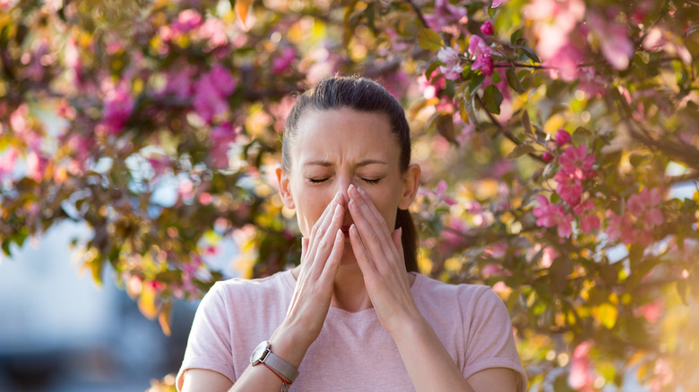 Woman sneezing