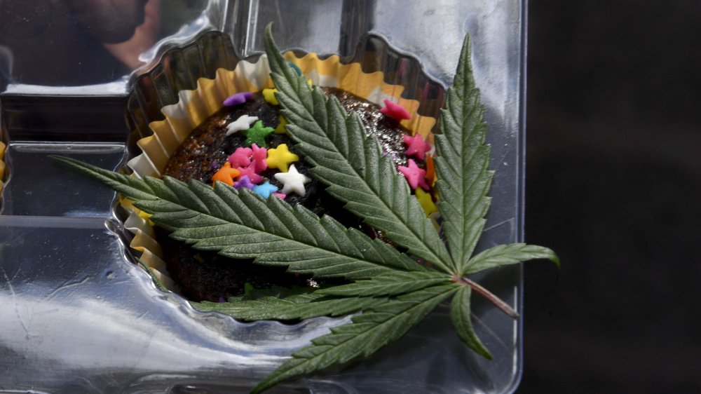 A cannabis brownie with sprinkles and a leaf