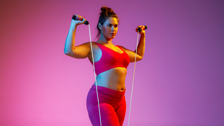 Woman posing with jump rope