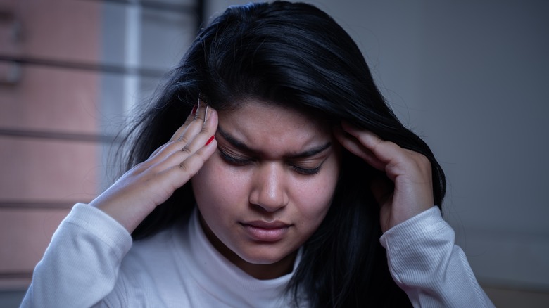 woman struggling to concentrate