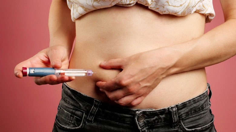 diabetic woman giving injection
