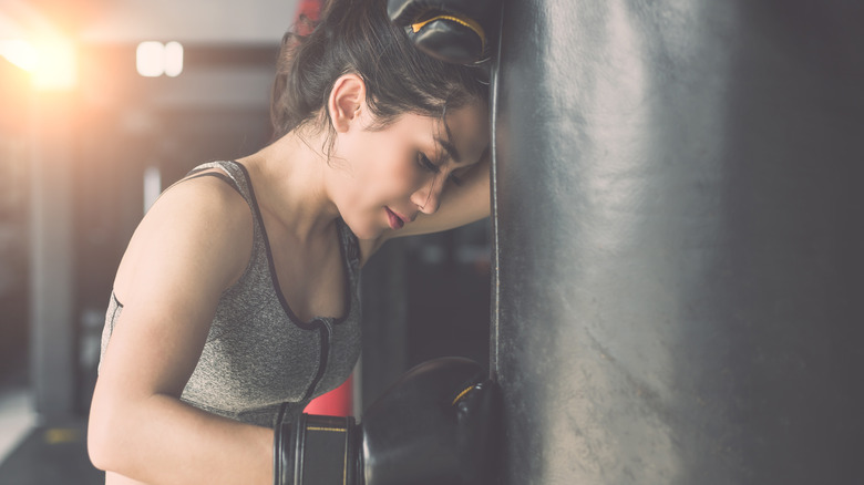 A woman wearing boxing gloves