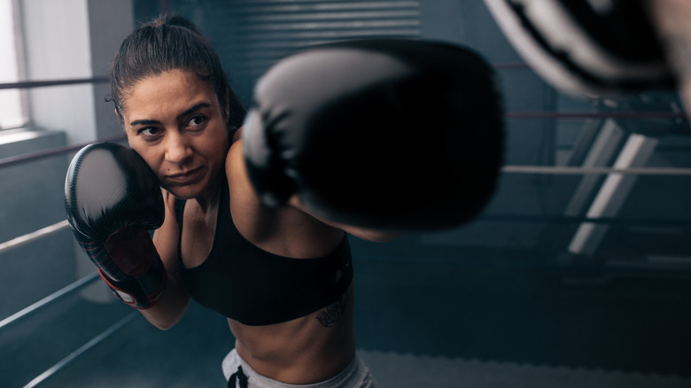 A woman wearing black gloves