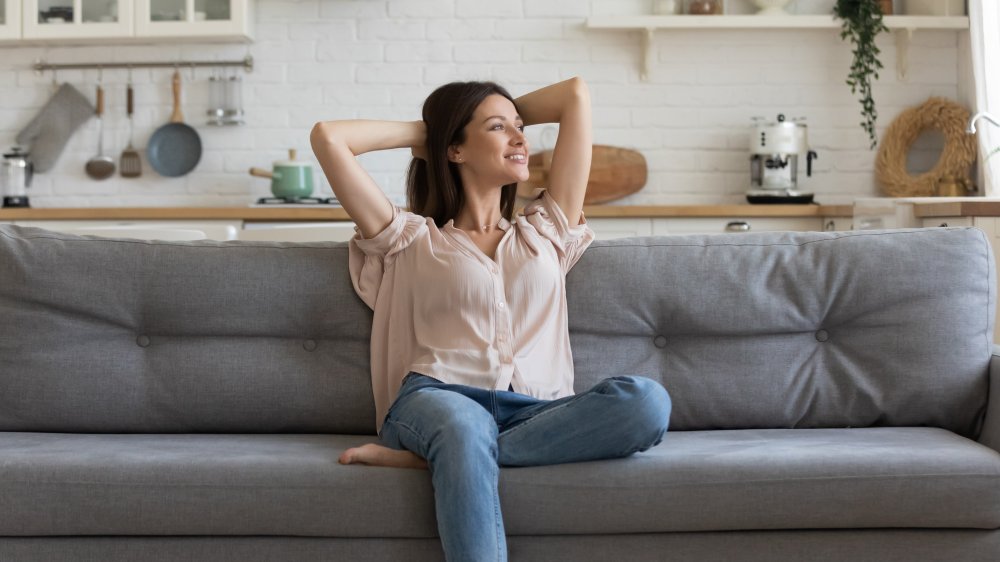 woman content on couch