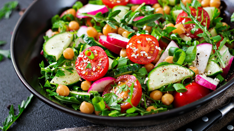 A salad with veggies and chickpeas