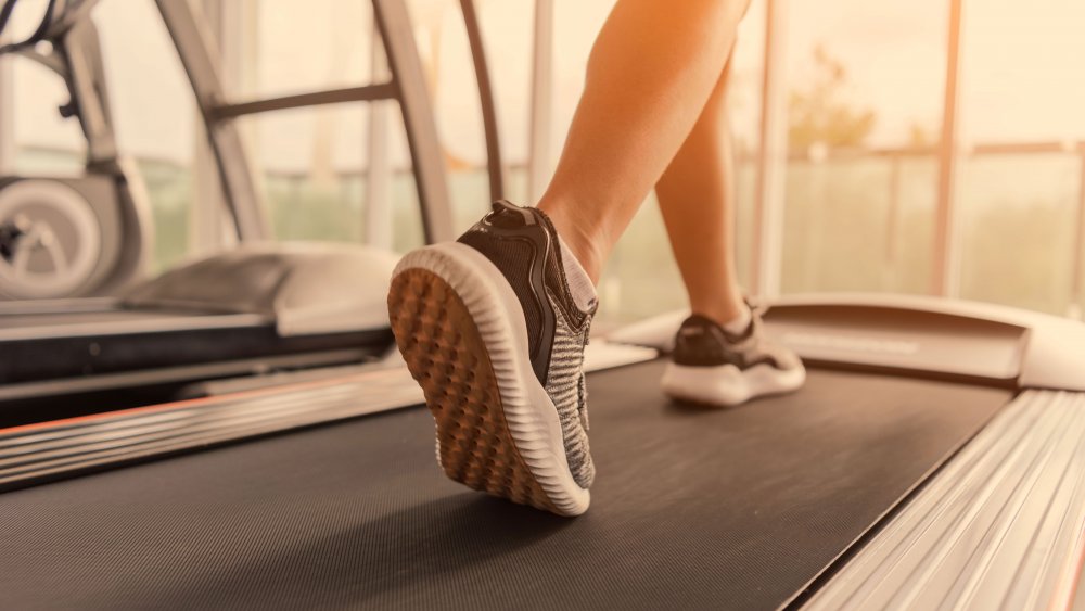 woman walking on treadmill