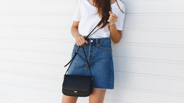 Woman in denim skirt