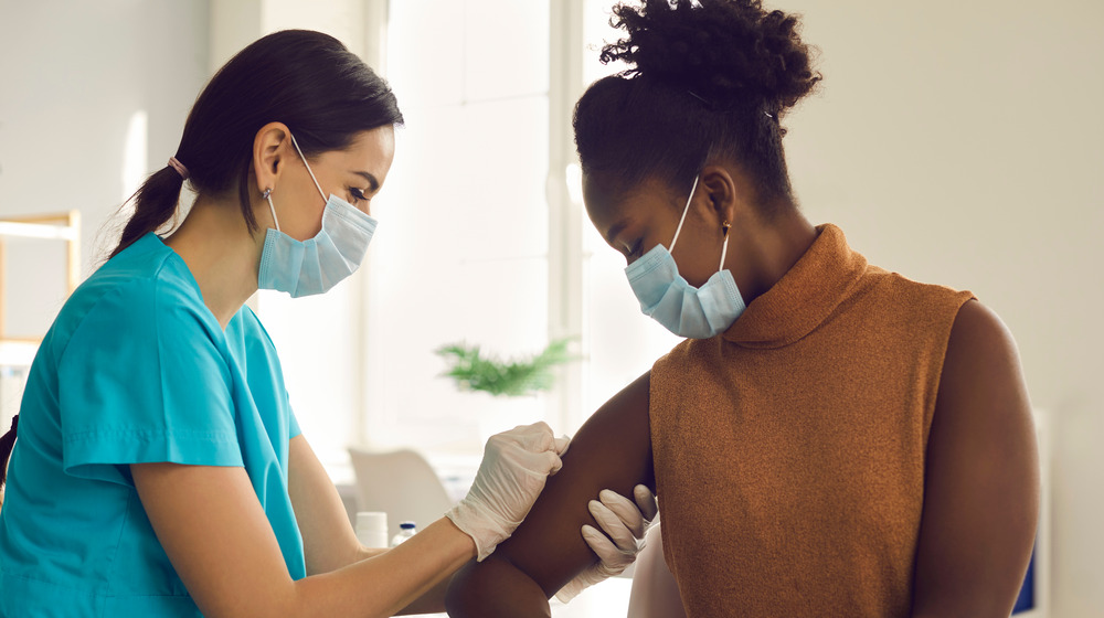 A woman getting a vaccination