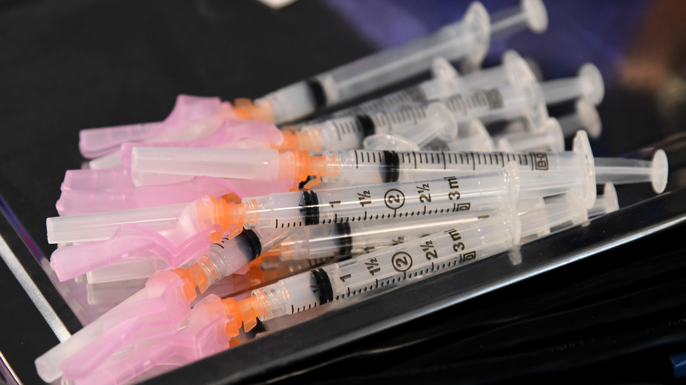 Syringes with the Moderna vaccine on a tray