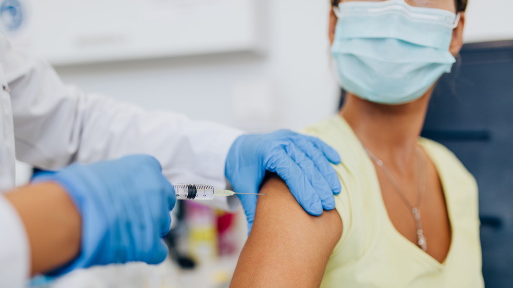 woman receiving COVID-19 vaccine 