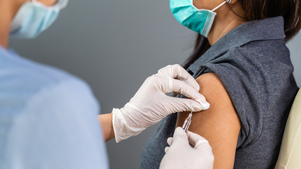 woman receiving vaccine